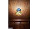 Close-up of a colorful stained glass lighting fixture set against a wood-paneled ceiling at 213 W Hightower Trl, Social Circle, GA 30025