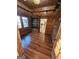 Office with wood walls, hardwood floors, and built-ins at 213 W Hightower Trl, Social Circle, GA 30025