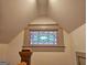 Close up of the stained glass window above the landing of the staircase at 213 W Hightower Trl, Social Circle, GA 30025