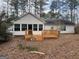 House back view with deck and wooded backyard at 1276 Turner Church Rd, Mcdonough, GA 30252