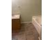 Bathroom with a garden tub and vanity at 1276 Turner Church Rd, Mcdonough, GA 30252