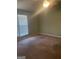 A bedroom featuring carpet, a ceiling fan with a light, and a window with blinds at 1276 Turner Church Rd, Mcdonough, GA 30252