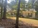 House exterior showcasing a ranch-style home with a yard at 1276 Turner Church Rd, Mcdonough, GA 30252