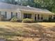 Ranch style home with mature landscaping and a spacious front yard at 1276 Turner Church Rd, Mcdonough, GA 30252