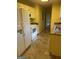Bright kitchen with white cabinets and linoleum flooring at 1276 Turner Church Rd, Mcdonough, GA 30252
