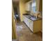 Kitchen with white cabinets and tile floor at 1276 Turner Church Rd, Mcdonough, GA 30252