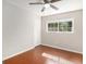 Simple bedroom with hardwood floors and large window at 2911 Allegro Nw Dr, Atlanta, GA 30318