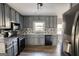 Modern kitchen with granite countertops and gray cabinets at 758 Shoreline Se Trl, Conyers, GA 30094