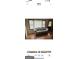 Bright living area with large windows, wood floors, and a comfortable sofa, perfect for relaxation at 5094 Covington Hwy, Decatur, GA 30035