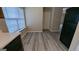 Kitchen with vinyl flooring and view of backyard at 6627 Coventry Pt, Austell, GA 30168