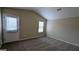 Spacious bedroom with neutral carpeting and an exterior door at 6627 Coventry Pt, Austell, GA 30168