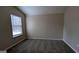 Bright bedroom featuring a large window and neutral wall color at 6627 Coventry Pt, Austell, GA 30168