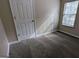 Simple bedroom with neutral walls and carpet flooring at 6627 Coventry Pt, Austell, GA 30168