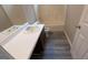 Clean bathroom with a tub and shower combination at 6627 Coventry Pt, Austell, GA 30168