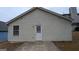 Rear view of house showing tan siding and patio at 6627 Coventry Pt, Austell, GA 30168