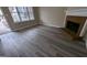 Spacious living room with fireplace and vinyl flooring at 6627 Coventry Pt, Austell, GA 30168