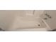Clean bathtub in a simple bathroom at 6627 Coventry Pt, Austell, GA 30168