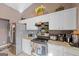 Kitchen features stainless steel appliances and white cabinets at 3367 Lineview Dr, Ellenwood, GA 30294