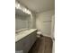 Bathroom features a double sink vanity, granite counters, and a shower and tub combo at 142 Asa Moseley Rd, Mcdonough, GA 30252