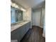 Bathroom featuring a double vanity with granite countertops and modern fixtures, designed for comfort at 142 Asa Moseley Rd, Mcdonough, GA 30252