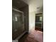 Bright bathroom features a glass enclosed shower and a separate soaking tub at 142 Asa Moseley Rd, Mcdonough, GA 30252