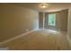 Unfinished bedroom with light, neutral-painted walls, a simple window, and overhead lighting at 142 Asa Moseley Rd, Mcdonough, GA 30252