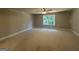 Large bedroom with a window bringing in natural light, perfect for creating a cozy space at 142 Asa Moseley Rd, Mcdonough, GA 30252