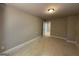 A simple bedroom with neutral walls and trim, with a door to an adjacent room at 142 Asa Moseley Rd, Mcdonough, GA 30252