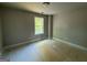 Bedroom featuring a window with natural light and neutral walls at 142 Asa Moseley Rd, Mcdonough, GA 30252