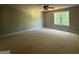 Spacious room with ceiling fan and a window bringing in natural light and scenery at 142 Asa Moseley Rd, Mcdonough, GA 30252