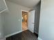 Bedroom with walk-in closet, wood-look flooring, and natural light at 142 Asa Moseley Rd, Mcdonough, GA 30252