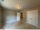 Bedroom with large closet and simple lighting with door that leads to another room at 142 Asa Moseley Rd, Mcdonough, GA 30252