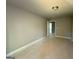 Bright bedroom with neutral walls, open door, and ample natural light at 142 Asa Moseley Rd, Mcdonough, GA 30252