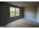 Bedroom featuring a window with natural light and neutral walls at 142 Asa Moseley Rd, Mcdonough, GA 30252