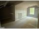 Spacious walk-in closet with shelving and a window offering ample storage at 142 Asa Moseley Rd, Mcdonough, GA 30252