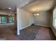 Spacious dining room with wood-look floors and an elegant chandelier, perfect for Gathering dinners at 142 Asa Moseley Rd, Mcdonough, GA 30252