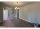 Inviting entryway features a staircase and stylish lighting, welcoming guests with warmth at 142 Asa Moseley Rd, Mcdonough, GA 30252