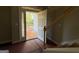 Entryway with wood stairs and door opening to a landscape with mature trees at 142 Asa Moseley Rd, Mcdonough, GA 30252