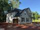 Beautiful new construction home with two-car garage, black shutters and a modern design at 142 Asa Moseley Rd, Mcdonough, GA 30252