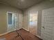 Hallway with wood-look floors and view to living area at 142 Asa Moseley Rd, Mcdonough, GA 30252