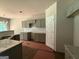 Bright, open-concept kitchen with granite counters and modern cabinets, providing ample space for cooking and storage at 142 Asa Moseley Rd, Mcdonough, GA 30252