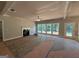 Bright living room showcasing a fireplace, large windows, neutral paint colors and plenty of natural light at 142 Asa Moseley Rd, Mcdonough, GA 30252