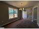 Bright living room with a large window, showcasing natural light and elegant wood-look flooring at 142 Asa Moseley Rd, Mcdonough, GA 30252