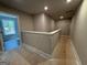 A well lit upstairs hallway leads to the bedrooms at 142 Asa Moseley Rd, Mcdonough, GA 30252