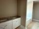 Double vanity bathroom with granite countertops and neutral colors, ready for finishing at 150 Asa Moseley Rd, Mcdonough, GA 30252