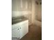Bathroom features single vanity with granite countertop and unfinished walls at 150 Asa Moseley Rd, Mcdonough, GA 30252