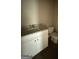 Bathroom featuring a vanity with a granite countertop and a white toilet at 150 Asa Moseley Rd, Mcdonough, GA 30252