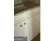 Close-up of vanity with granite countertop and white cabinets in the bathroom at 150 Asa Moseley Rd, Mcdonough, GA 30252
