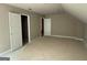 Upstairs bedroom featuring neutral walls, white trim and doors, plus a dormer window at 150 Asa Moseley Rd, Mcdonough, GA 30252