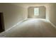 Unfinished bedroom featuring a window with green views and a large, open layout at 150 Asa Moseley Rd, Mcdonough, GA 30252